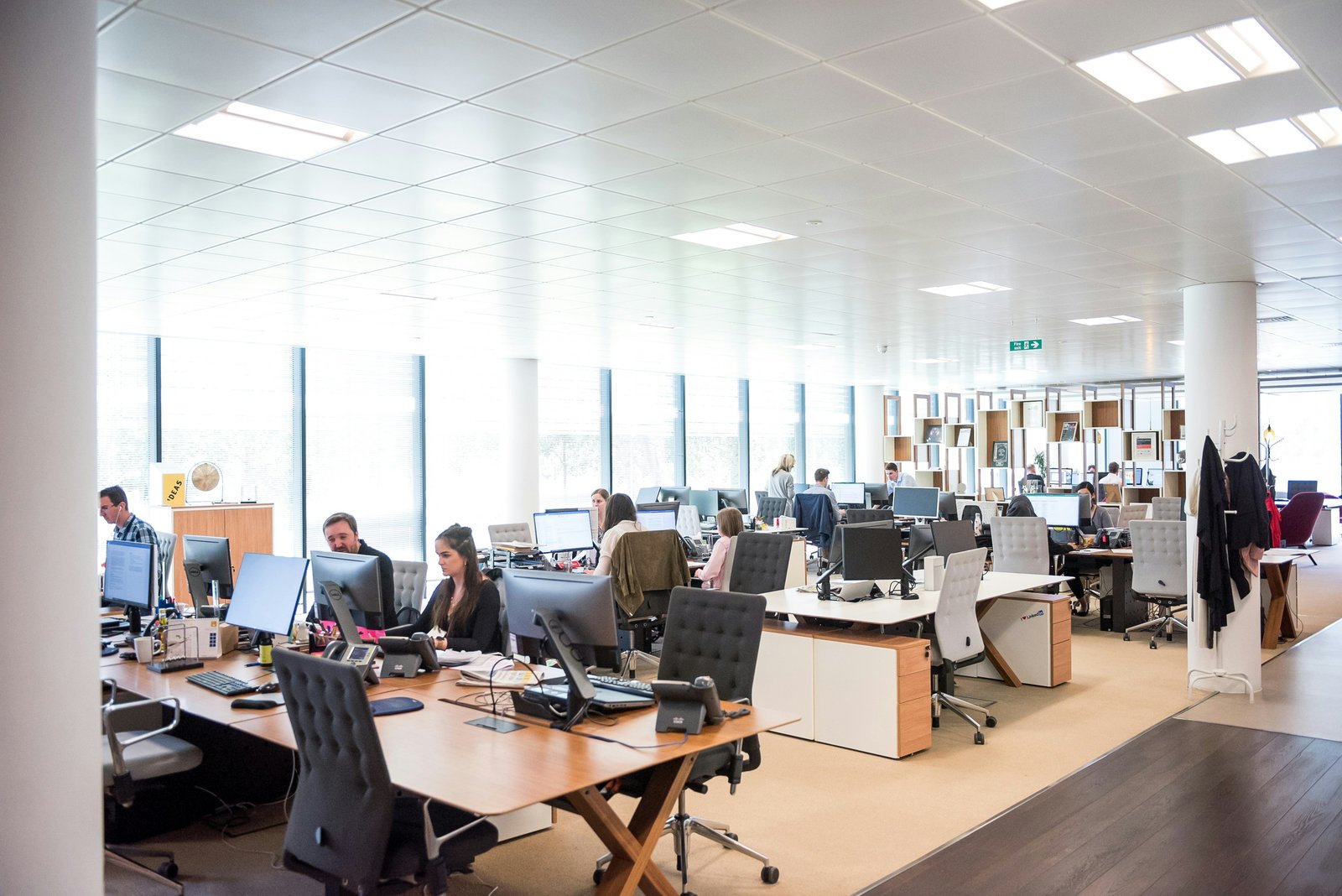 Support team working at desks in an open office
